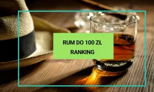 Słomkowy kapelusz i szklanka z bursztynowym płynem. Ranking najlepszego polskiego rumu do 100 zł.